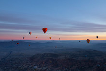 Balloons Seen From Goreme, Cappadocia With Beautiful Sunrise And Colourful, Golden, Orange, Pink And Blue Sky. It's Fun, Excited And Impress Activity At Turkey.