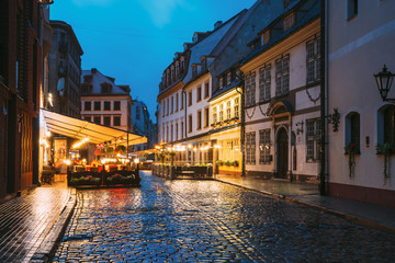 Riga, Latvia. Museum Of Decorative Arts And Design And Cafe In Lighting At Evening Or Night Illumination In Old Town In Skarnu Street