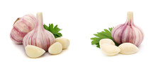 Garlic With Leaves Of Parsley Isolated On White