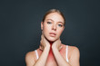 © millaf (Nemchinova) - Woman with sore throat on gray background. Flu epidemic concept