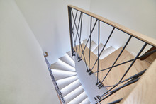Stairs To The Top. Design Stairs Made Of Metal And Wood. Backed Up. Metal Railing In Black