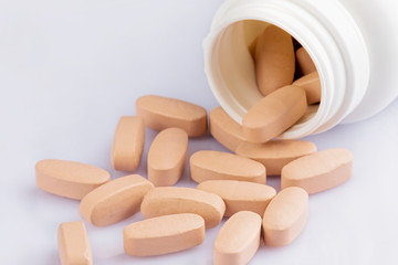 Close up of Multi-Vitamin and mineral on white background