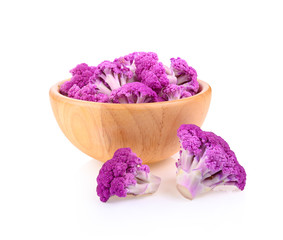 Wall Mural - Purple cauliflower in wooden bowl on white background