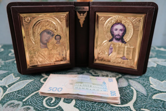 The Holy Bible Icons Surrounded With Money