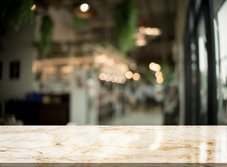 Empty stone table top with light bokeh on blurred restaurant background