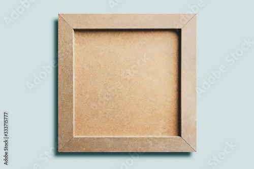 Cuadros en Lienzo Wooden picture , isolated on blue background