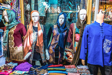 Sticker - Clothes for sale on the Grand Bazaar also called Qeysarriyeh or Soltani bazaar in Isfahan city, Iran