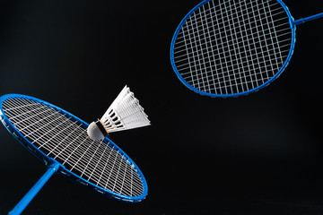 Wall Mural - Badminton sport equipment on dark black background close up