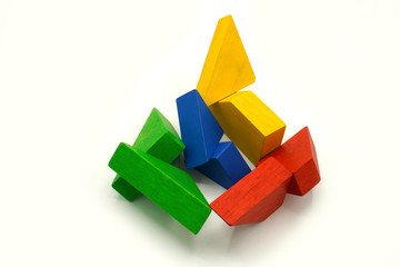 Twisted colorful building blocks made of wood. Educational toy and logical puzzle. Abstract mobile structure.