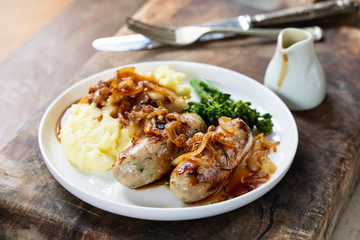 Sausages with fried onions and mashed potatoes