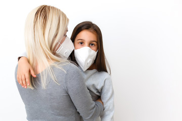 young mother wearing protective PM2.5 mask for her Daughter. isolated on white background.