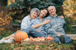 © prostooleh - Senior with box of apple. Brunette in a blue shirt. Grandparents with grandaughter.