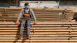 © Med Photo Studio - Portrait of young man carpenter at the wooden warehouse is resting