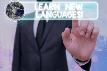 Poster - Writing note showing Learn New Languages. Business concept for developing ability to communicate in foreign lang Elements of this image furnished by NASA