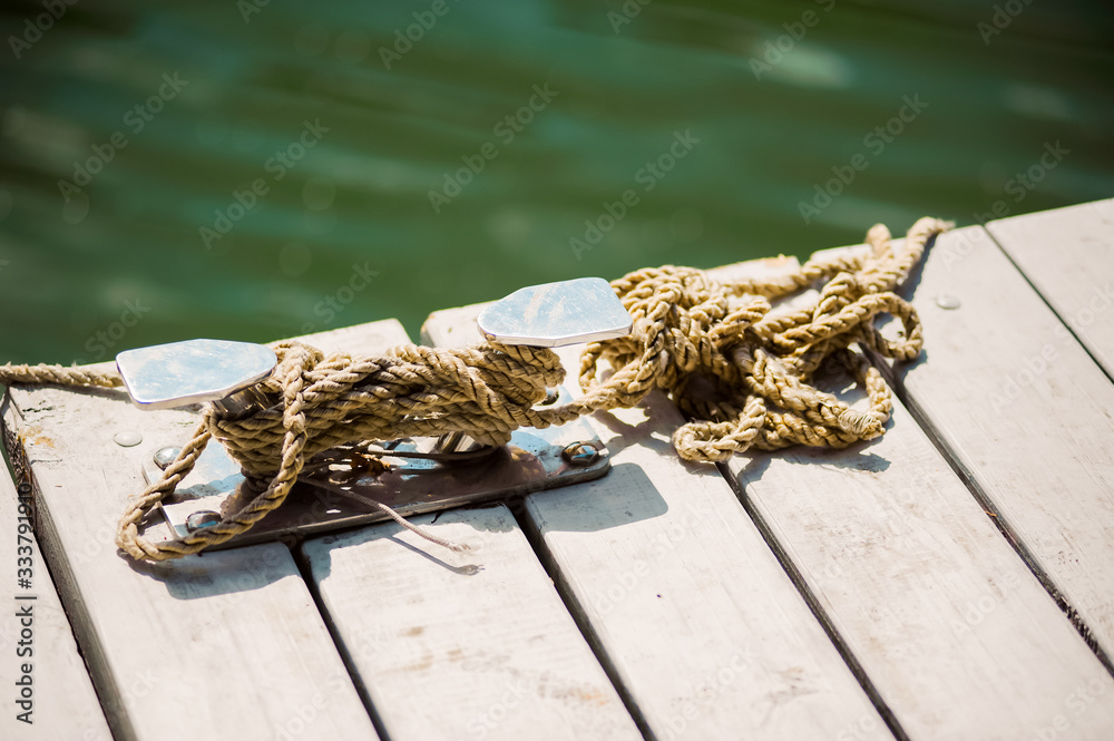 Rope wound on mooring bollards Stock Photo | Adobe Stock