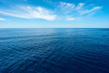nobody in blue sea with horizon under blue sky in greece