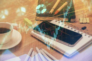 Double exposure of forex chart drawing and cell phone background. Concept of financial trading