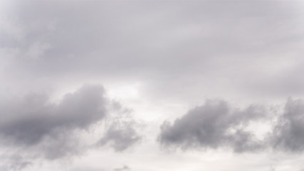 Wall Mural - Dramatic gray clouds in the sky. Beautiful gray and white cloudy sky, 16:9 panoramic format