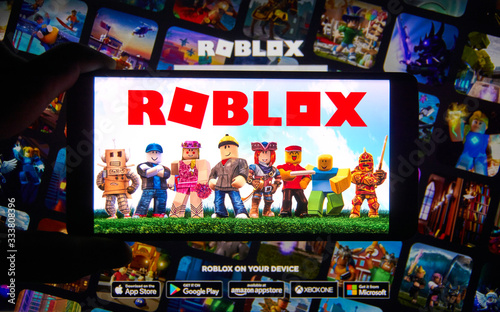 Roblox Logo And App On A Mobile Screen In A Hand Buy This Stock