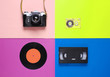 Retro top view still life. Vinyl record, vintage film camera, video and audio cassette on colored background. Flat lay. Pop art