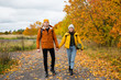 © Di Studio - cute couple of hikers with backpacks hiking in forest