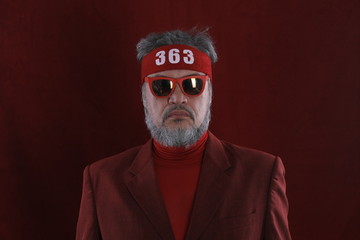 Canvas Print - Studio shot closeup portrait of a bearded man in red