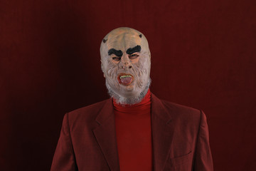 Canvas Print - Studio shot closeup portrait of a bearded man in red