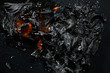 Burning piece of black paper on a black background.
