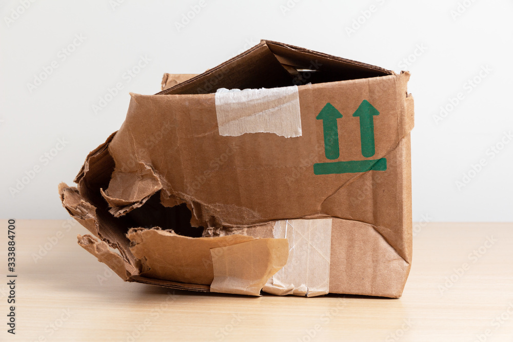 damaged crumpled postal cardboard box - obrazy, fototapety, plakaty 