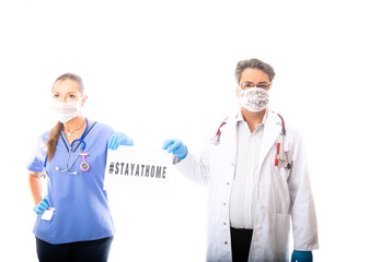 Two medical staff hold a sign during Coronavirus COVID-19 pandemic outbread