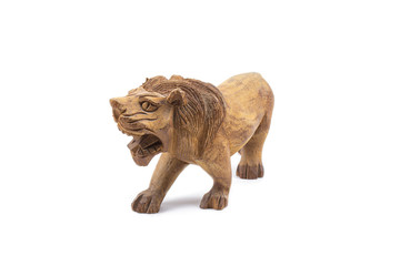 Lion carved out of hardwood isolated on a white background.