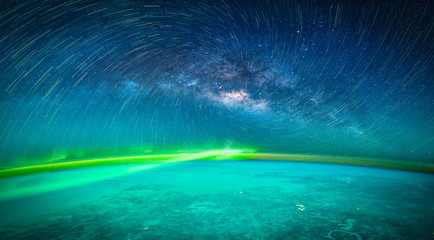 Wall Mural - landscape with milky way galaxy. earth and aurora view from space with milky way galaxy. (elements o