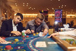 Friends gamble poker roulette in a casino