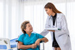 © wirojsid - Asian medical doctor take care senior elderly woman female patient on wheelchair