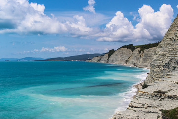 beautiful summer view of the rocks and wild beach in the camp 