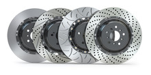 Different Types Of Brake Disks. Drilled And Slotted Brake Disks In A Row.