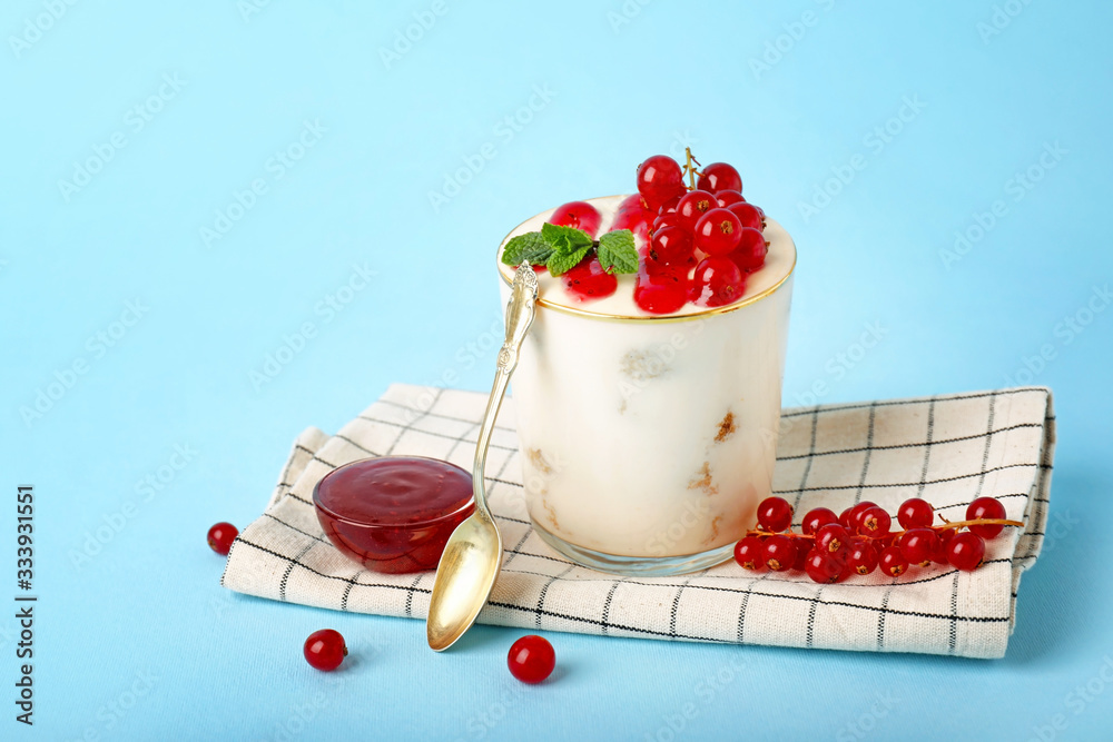 Tasty tiramisu with berries on color background