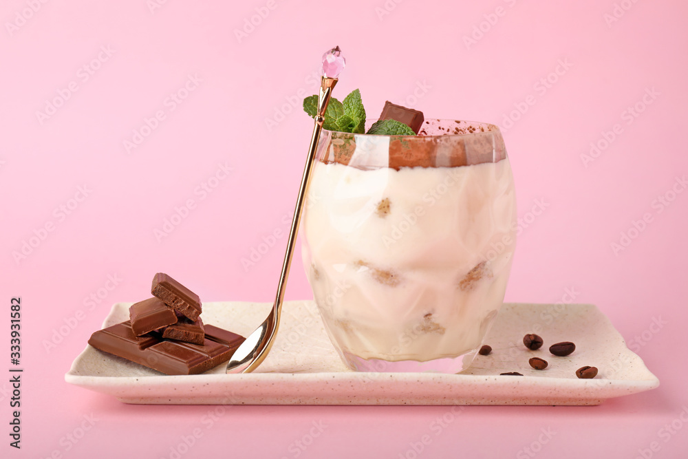 Tasty tiramisu on color background