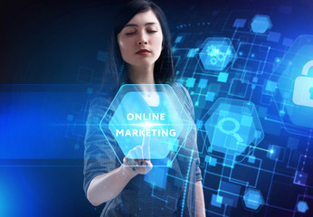 Business, Technology, Internet and network concept. Young businessman working on a virtual screen of the future and sees the inscription: Online marketing