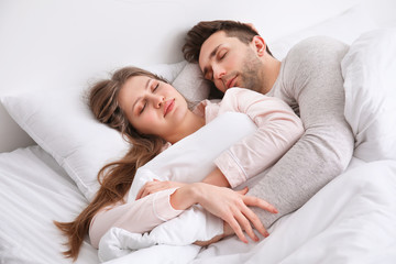 Sticker - Young couple sleeping in bed