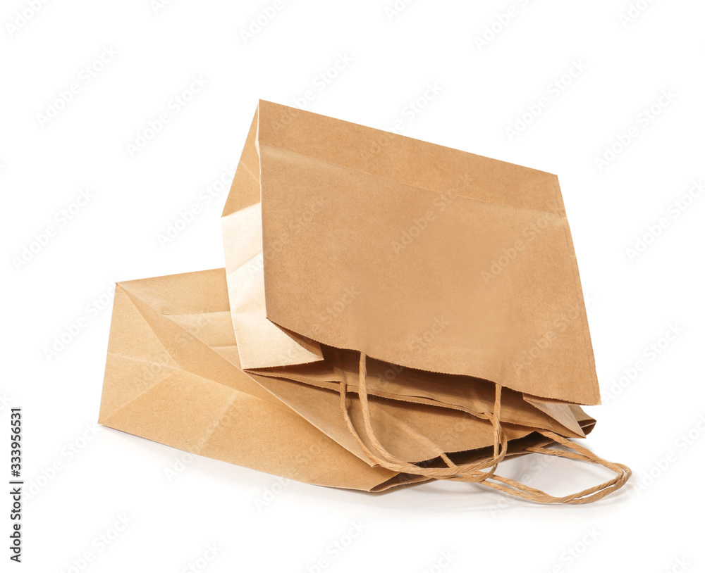 Paper shopping bags on white background