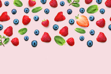 Fresh Berry And Fruit Mix Border Frame Banner Of Ripe Berries And Mint Leaves On Pink Background. Flat Lay. Fruit Pattern