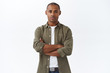 © Cookie Studio - Young serious-looking, confident african american male employee, cross hands chest, waiting for appointment, apply for job position, look determined, standing white background
