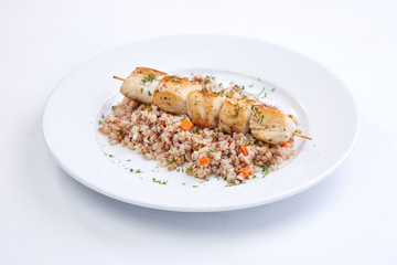 Wall Mural - chicken kebab with buckwheat on the white plate