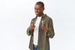 © Cookie Studio - You got it, congratulations. Portrait of cheeky, handsome african-american man winking and smiling, praising great job, pointing fingers at camera, picking, making his choice, flirting someone