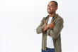 © Cookie Studio - Portrait of african-american handsome man, looking pleased and assured, cross hands chest confident, promotion of client and customer support, delivery, online shopping, white background