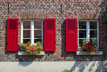 Old German House With Windows With Wooden Shutters