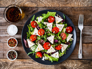 Canvas Print - Fresh greek salad - feta cheese, tomato, lettuce, black olives and onion