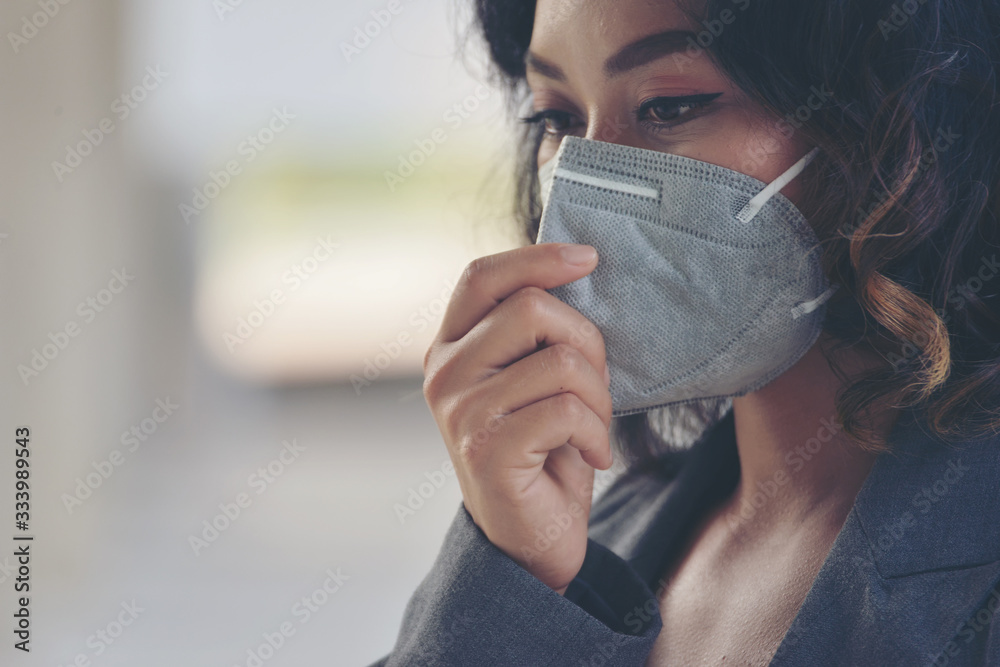 Covid-19 patient coughing and wearing a medical mask to protect from the coronavirus and bacteria While being outdoors and in community.  Covid-19 Virus Protection concept - obrazy, fototapety, plakaty 