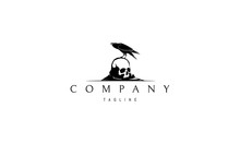 Vector Logo On Which An Abstract Image Of A Raven Sitting On A Skull.